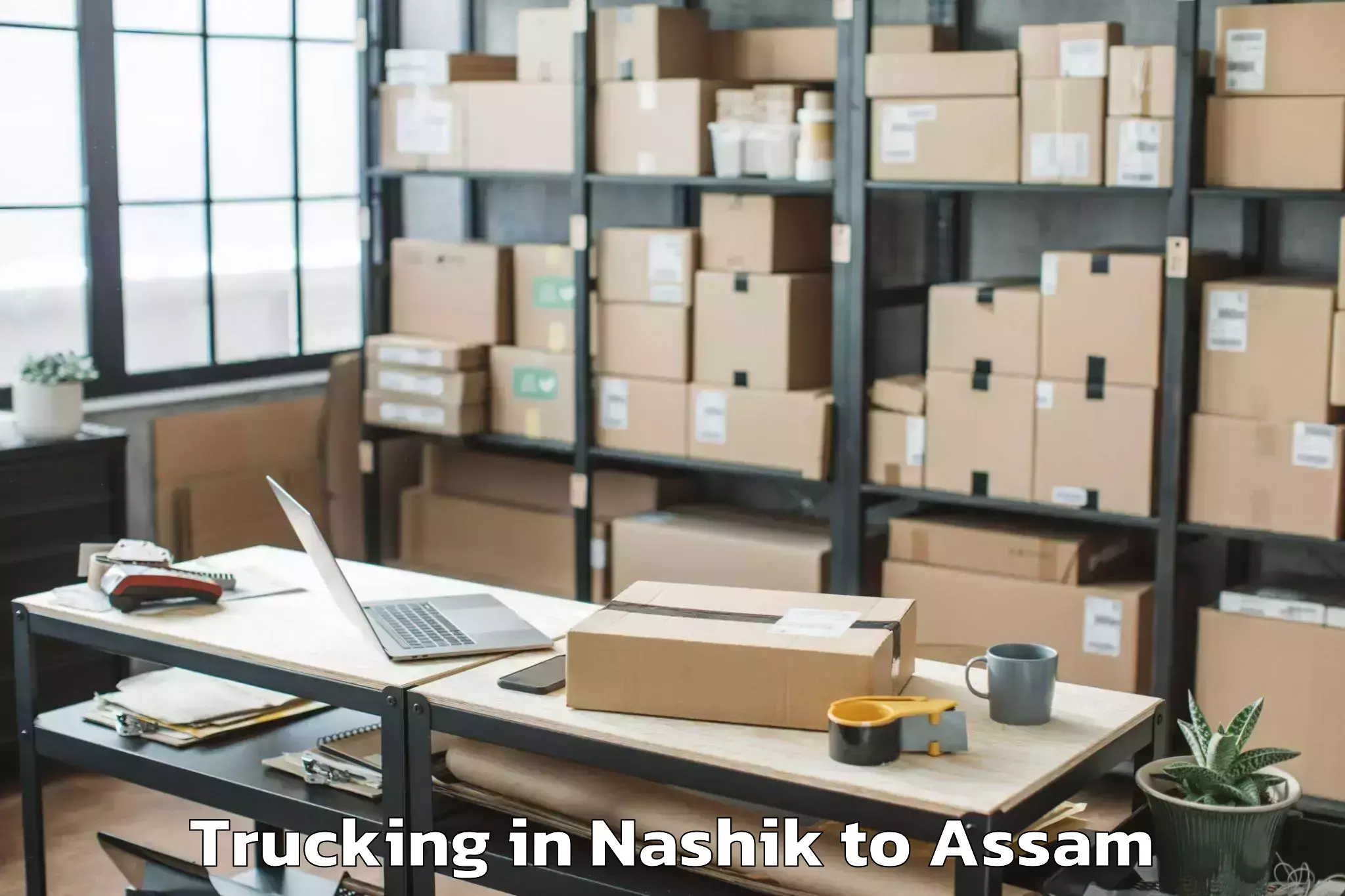 Top Nashik to Silapathar Trucking Available